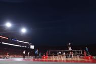 Laney Choboy wearing jersey no.6 doing a serve for the Nebraska Volleyball program (Image via: Getty Images)
